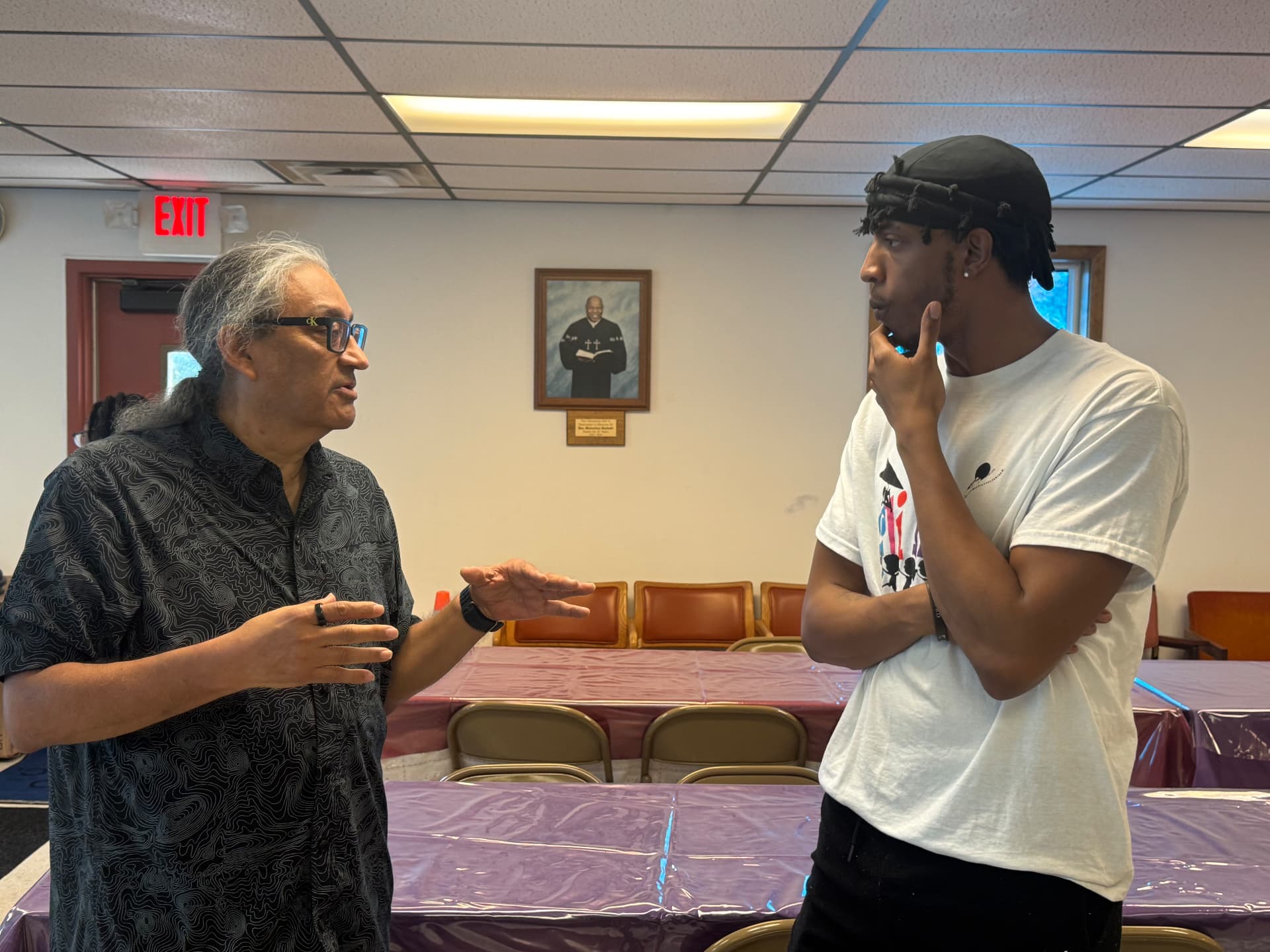 A FliKidz mentor speaking with a young participant